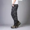 Pantalones casuales gruesos para exteriores de primavera y otoño para hombre, de montañismo, multibolsillos, de talla grande, rectos, sueltos, tácticos, de algodón puro.