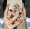 Parche de uña postiza de cadena francesa negra de longitud media con lazo tridimensional producto terminado manicura usable elegante ligeramente madura