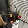 Bolso Pequeño de Moda Retro para Mujer Invierno 2026 Estilo Nuevo Bolso Cubo Pequeño Texturizado Bolso Cruzado Simple para Hombro para Mujer