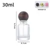 Botella de perfume de vidrio transparente en stock, venta directa, con tapa de bola, botella vacía rellenable de prensa-spray cosmético portátil