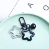 Colgante llavero de pentagrama doble creativo en stock con cascabeles de colores, accesorios para decoración de bolsos de mujer DIY hechos a mano