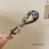 Pinza de pelo retro minimalista para mujer, pinza de torsión con cuentas para la parte trasera de la cabeza, accesorio para el pelo de clip recto estilo ins con ambiente café con leche