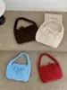 Nuevo bolso tote casual 2026 para el uso diario, estilo coreano, bolso de mano de punto chic y versátil
