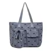 Bolsa tote transfronteiriça nova, simples, fofa, moderna, bolsa de ombro única para o dia a dia, bolsa de axila de moda nicho, laço retrô