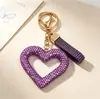 Nuevo llavero con forma de corazón hueco con diamantes, accesorio de arcilla totalmente cubierto de diamantes, decoración para bolso de mujer, colgante para interior de coche