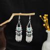 Pendientes geométricos redondos de estilo étnico transfronterizo europeo y americano, con borlas largas y atracciones turísticas retro bohemias.