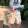 Venta al por mayor del fabricante Bolso de mano artístico de moda Bolso de lona Bolso tipo cubo de gran capacidad para mujer 2026 Nuevo Bolso para almuerzo de trabajo