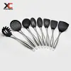 Venta al por mayor de fábrica Sartén antiadherente resistente a altas temperaturas Mango especial de acero inoxidable Espátula Juego de utensilios de cocina de silicona Pala para cocinar en la cocina