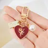 Llavero Lindo Chica Corazón Rosa Amor Placa Aleación Cabeza de Llavero para Coche Colgante de Auriculares Accesorios para Colgar en Bolsos