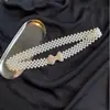 Cinturón decorativo para mujer versión coreana de Joker cadena de cintura de perlas con diamantes de imitación cadena de cintura elástica de verano para mujer venta al por mayor directa de fábrica