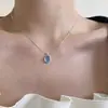 Colar de Pedra da Lua Água-Marinha Design de Nicho Feminino Pingente Oval de Alto Padrão Luxo Acessível Moda Corrente Ossinho de Cobra Nova Tendência