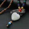 Corrente de suéter estilo étnico vintage colar longo masculino e feminino versátil Madeira Asa de Frango requintado algodão e linho ornamentos de vestuário decoração