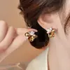 Pendientes de botón de cristal marrón y perla, diseño de nicho, versión coreana 2025, pendientes Maillard, nuevos pendientes de alta gama 2025