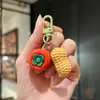 Llavero creativo de caqui personalidad simulación de caqui bolsa de cacahuete colgante pequeño venta al por mayor decoración divertida para coche