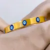 Nova pulseira de olho de diabo em aço titânio transfronteiriça europeia e americana, banhada a ouro 18K, de nicho, versátil e não desbota