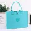 Bolsas de feltro personalizadas, de grande capacidade, em formato de ursinho de pelúcia, adequadas para eventos corporativos, banquetes de negócios e como bolsas de presente de feltro portáteis; impressão de logotipo disponível