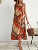 Vestido de tirantes bohemio estampado estilo resort europeo y americano para mujer, sin mangas, holgado, adelgazante, elegante, de longitud media, venta al por mayor