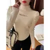 Camiseta base de punto para mujer con cuello semialto y diseño calado para otoño e invierno, suéter blanco elegante, nuevo top de punto ajustado 2026