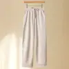 Novos estilos de outono e inverno para mulheres de meia-idade e idosas: calças forradas com fleece e cós elástico, calças cigarette estilo mom, padrão espinha de peixe, calças casuais cropped