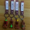 Al por mayor de Anime Transfronterizo Juguete de Moda Llavero Oso Violento Lindo Oso Rayo Muñeco de Silicona Colgante de Astronauta para Pareja