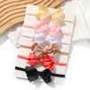 Set de lazos para niños de venta caliente transfronteriza, diadema elástica de color liso con diseño floral, accesorios para el cabello para niños al por mayor 351