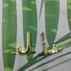 Moda Letras Mayúsculas Inglesas Accesorios de Metal Aleación de Zinc Logo MK S Joyería Accesorios para el Cabello Pin Metálico Europeo y Americano