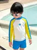 Traje de baño de manga larga para niños Verano 2025 Nuevo estilo Pantalones de playa junto al mar Traje de baño de dos piezas para niños Protección solar Secado rápido Resistente al cloro
