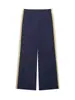 Chamarra de moda europea y americana transfronteriza con bloques de color, tela técnica, acentos de franjas laterales y pantalones casuales