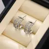 Brincos de Argola Cruzados Populares Transfronteiriços com Emendas de Cor Micro-Embutidos para Mulheres Cobre Banhado a Ouro Nicho High-End Luxo Leve Retro Abertos