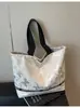Bolsa de Lona Transfronteriza para Mujer, Gran Capacidad, Nueva Versátil Bolso de Hombro Otoño e Invierno 2026, Bolso Tote con Remaches de Mariposa para Estudiante Universitario