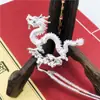 Accesorios para joyería DIY horquilla antigua aleación Perla de Dragón paso sacudida ropa china materiales caseros hechos a mano outlet de fábrica