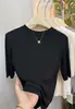 Nueva camiseta elegante de cuello alto medio y manga de cinco cuartos para mujer, colección de verano 2026, versátil y favorecedora, top de manga media a la moda