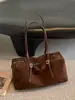 2026 Outono Inicial Nova Bolsa de Bowling Fosca Estilosa Retrô para Mulheres Sensação de Alto Padrão Bolsa Almofada Bolsa de Ombro