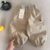 Pantalones para Niños Primavera y Otoño Nuevas Llegadas Niños y Niñas Bebé Color Sólido Bordado Pantalones de Algodón Joggers Sueltos Modernos