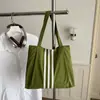 Bolso tote de lona de gran capacidad estilo casual coreano 2026 para mujer, nuevo bolso de mano de moda para estudiantes, adecuado para la escuela y el trabajo