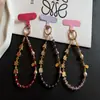 Cadena Creativa para Teléfono Móvil con Temática de Texto, Cuentas de Cristal de Aleación, Correa de Muñeca, Colgante Rojo de Año Nuevo