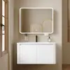 Tocador de baño engrosado y ahorrador de espacio con diseño en color crema, que cuenta con un lavabo redondeado, lavabo cerámico integrado y un lavabo de una sola pieza.