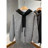 Nuevo suéter de punto con capucha para otoño e invierno para hombres y parejas, cuello Henry de bloques de color, chaqueta estilo old money, venta al por mayor de fábrica transfronteriza