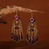 Pendientes de estilo étnico pendientes largos de colores pendientes de temperamento retro pendientes colgantes Joker venta al por mayor