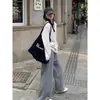 Camiseta Listrada de Gola Redonda e Manga Longa com Design Único para Mulheres, Novo Corte Solto para Primavera e Outono, Adequada para o Trabalho e Casais
