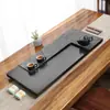 Bandeja de té de piedra negra natural para uso doméstico, estilo de lujo ligero nuevo, pieza entera con drenaje integrado, losa de mesa de té de piedra