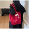 Bolso tote grande de estilo casual para mujer, nuevo bolso de mano ligero color neón con diseño de corazón, adecuado para estudiantes universitarios que van a clase.
