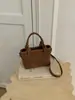 Bolso tipo cubo de tejido de alta gama para mujer, nuevo y elegante, estilo verano chic, de un solo hombro y cruzado