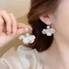 Exquisitos brincos de laço estilo francês para mulheres, luxo leve com um toque de alta qualidade, brincos de tarraxa elegantes, design de nicho, brincos de franja longa