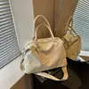 Nova tendência da moda de verão bolsa de ombro, grande capacidade, textura simples, bolsa tote feminina de nicho 2026