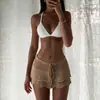 Nueva falda mini bodycon de punto de color liso, estilo de comercio exterior europeo y americano, con volantes, corte ajustado, diseño en capas, lista para la playa, con tiras de amarre y cordón