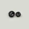 Moda redonda mariposa negro y blanco plástico botón camisa cárdigan suéter tejido abrigo hebilla decorativa cabeza cuerda accesorios