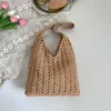 Bolsa tejida de gran capacidad transfronteriza para mujer, nuevo bolso de hombro versátil casual calado 2026, bolsa de playa estilo vacación costera