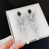 Pendientes de borla de mariposa hueca con perlas, tachonados de diamantes, estilo vintage europeo y americano, pendientes de lujo ligero de alta gama con un diseño de nicho