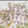 Colgante de lazo de amor de网红 aleación joyería para uñas cadena de borlas murciélago de Halloween decoración de uñas venta al por mayor